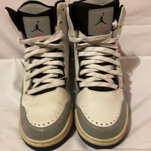 White Jordan high top sneakers.